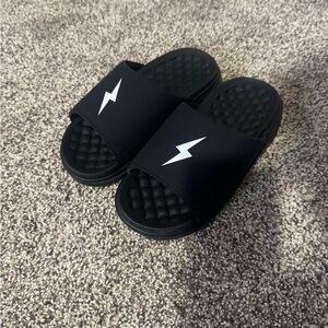 Kids Bruce Bolt Black Slide Sandals with White Lightning Accent